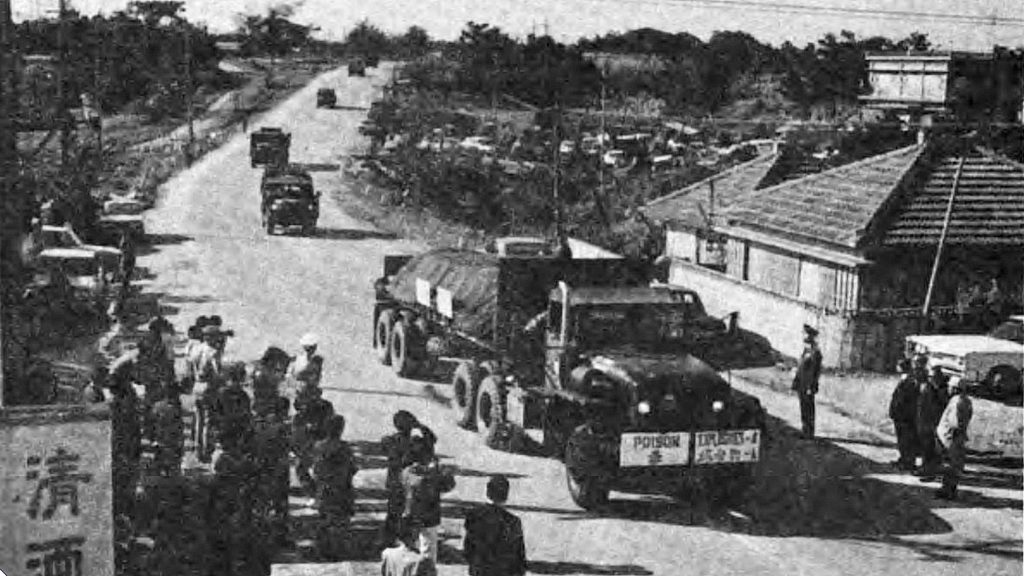 Trucks loaded with US chemical weapons pass through Noborikawa, Okinawa. Photograph taken in 1971. Creative Commons Attribution-NonCommercial-ShareAlike 2.0 Generic (CC BY-NC-SA 2.0). https://creativecommons.org/licenses/by-nc-sa/2.0/ Creator: George Lane. Source: Flickr.com
